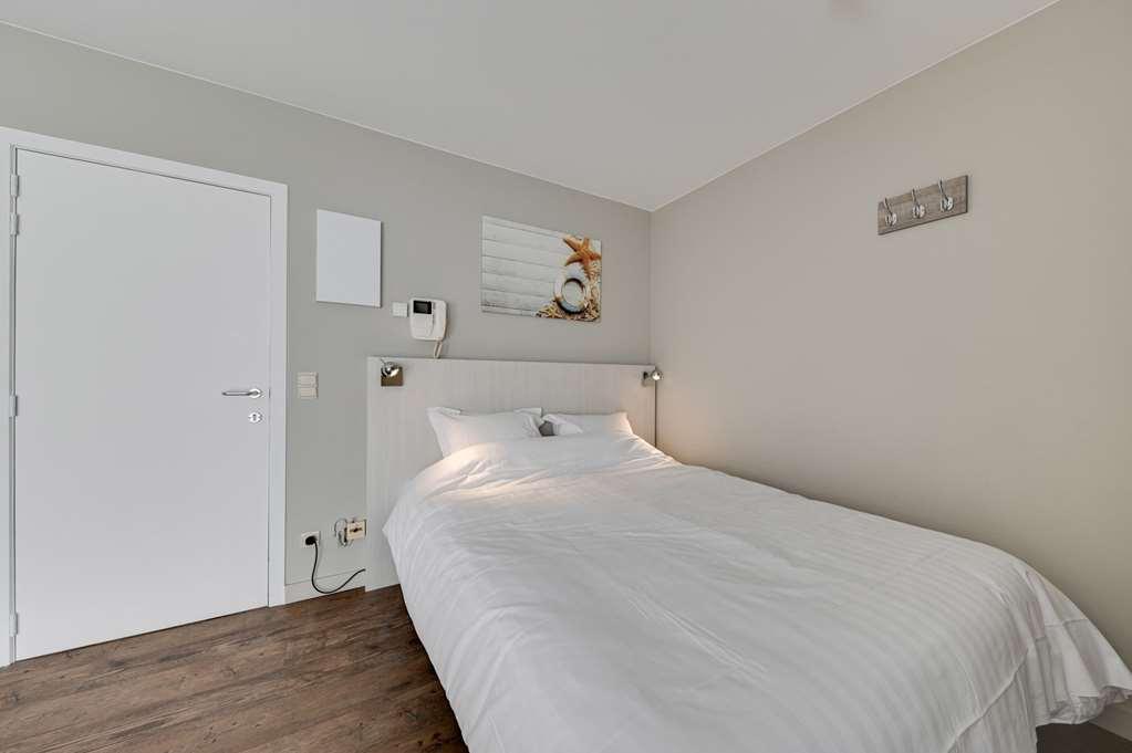 Holiday Suites Де Хаан Стая снимка